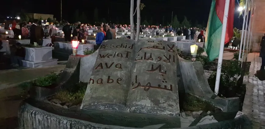 On the eve of Eid al-Fitr, candles are lit on martyrs' shrines 