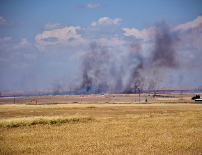 Turkish occupation mercenaries set fire to crops in Tal Tamr countryside