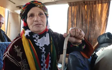 She walks to Tishrin Dam with her crutch