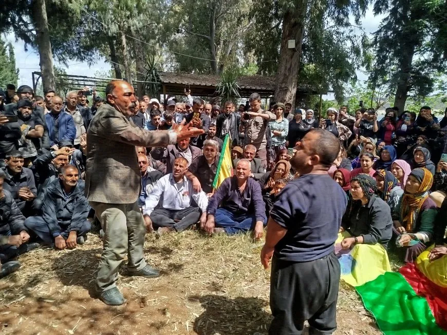 Protesters commemorate mother Awesh, martyrs during Friday prayers at Tishrin Dam