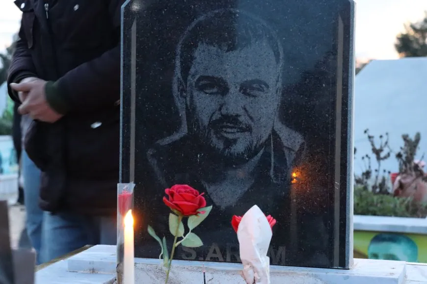 Lighting candles at Martyrs' Shrines in Qamishlo on eve of Newroz