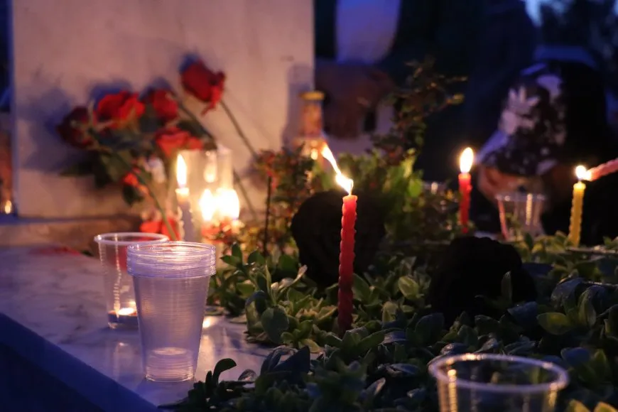 Lighting candles at Martyrs' Shrines in Qamishlo on eve of Newroz