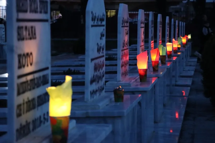 Lighting candles at Martyrs' Shrines in Qamishlo on eve of Newroz