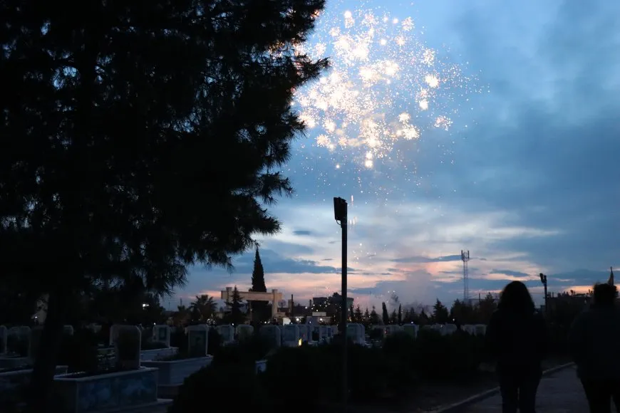 Lighting candles at Martyrs' Shrines in Qamishlo on eve of Newroz