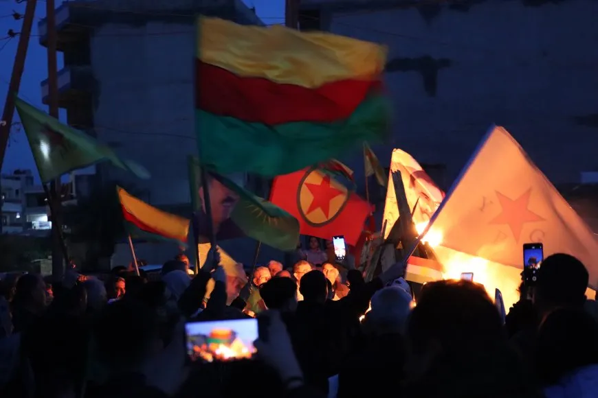 Lighting candles at Martyrs' Shrines in Qamishlo on eve of Newroz