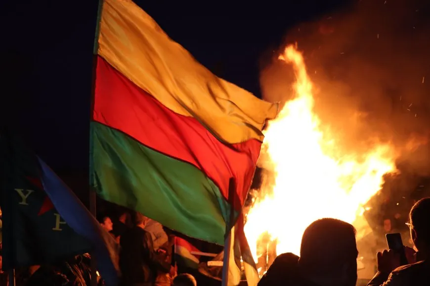 Lighting candles at Martyrs' Shrines in Qamishlo on eve of Newroz
