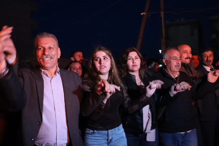 Lighting candles at Martyrs' Shrines in Qamishlo on eve of Newroz