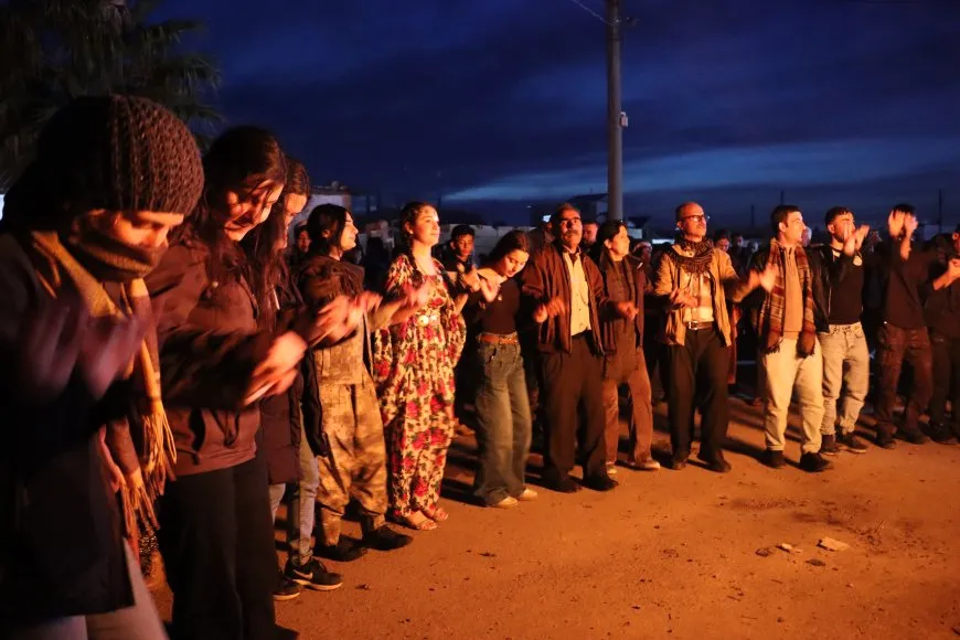 Lighting candles at Martyrs' Shrines in Qamishlo on eve of Newroz