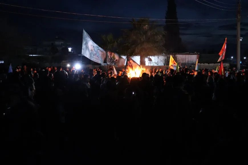 Lighting candles at Martyrs' Shrines in Qamishlo on eve of Newroz