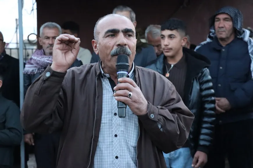 Lighting candles at Martyrs' Shrines in Qamishlo on eve of Newroz