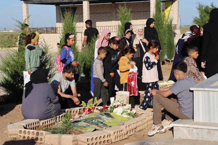 Residents of Jazera and Kobani cities celebrate first day of Eid by visiting martyrs' shrines