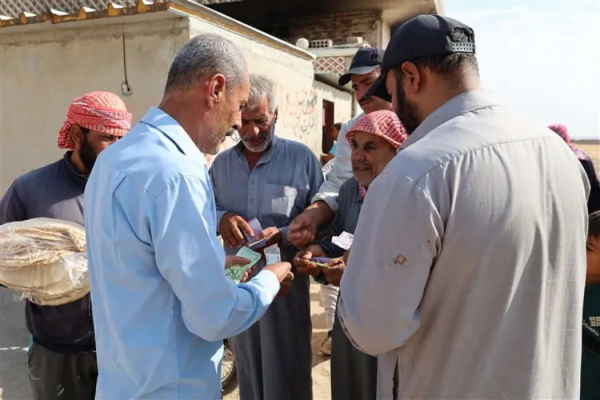 La iniciativa humanitaria en Tal Tamr ayuda a los residentes a cambiar moneda para comprar pan