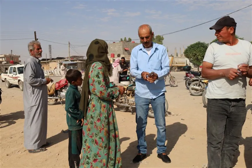 La iniciativa humanitaria en Tal Tamr ayuda a los residentes a cambiar moneda para comprar pan