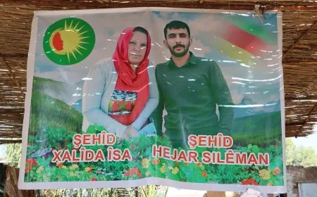 Li ser riya azadiyê dayikek û kurê xwe
