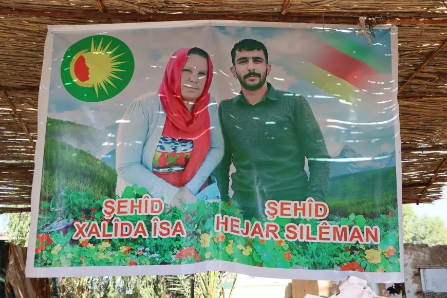 Li ser riya azadiyê dayikek û kurê xwe
