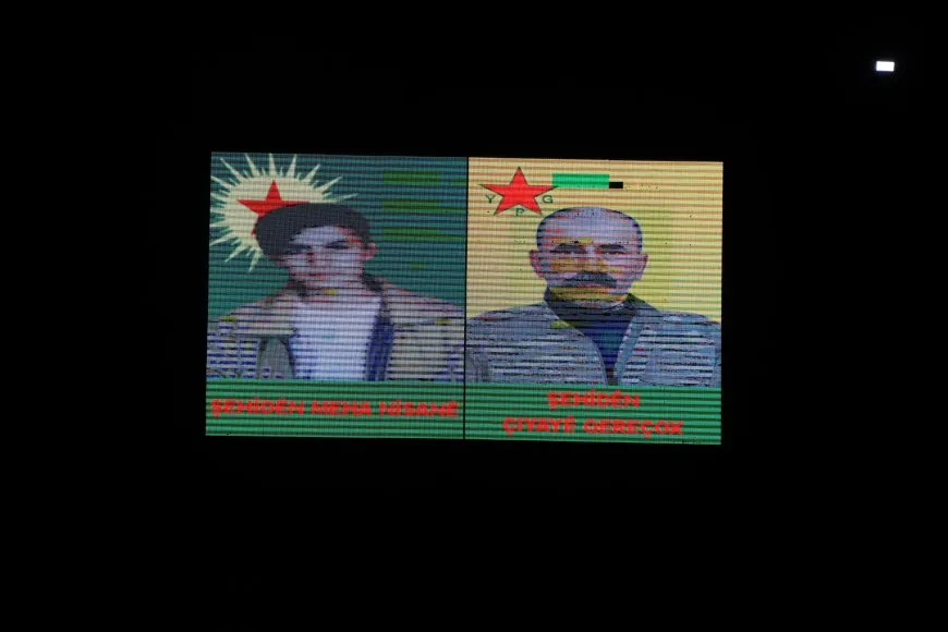 Di roja şehîdan de şêniyên Kobanê mûm li ber serê şehîdan vêxistin